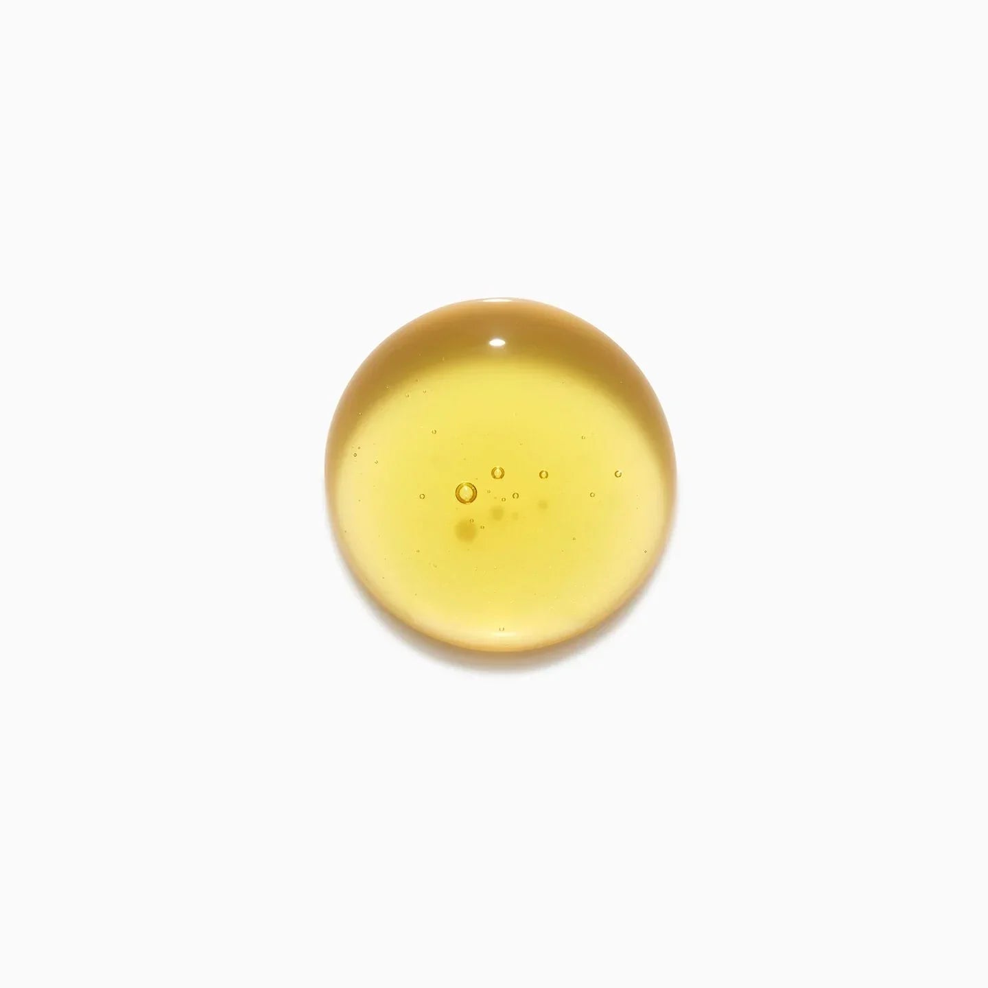 Yellow droplet on a white background