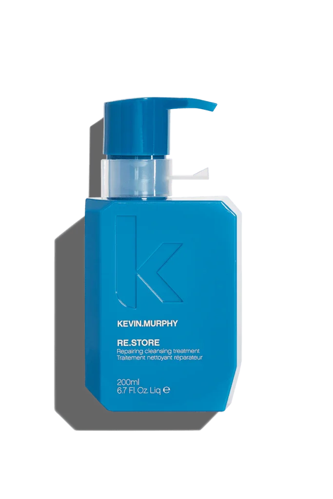 A blue bottle of Kevin Murphy Re.Store hair treatment with a pump dispenser.