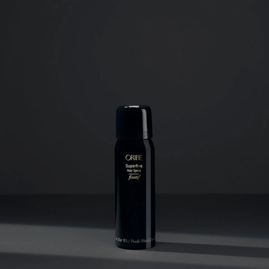 Black Oribe hair product bottle on a dark background