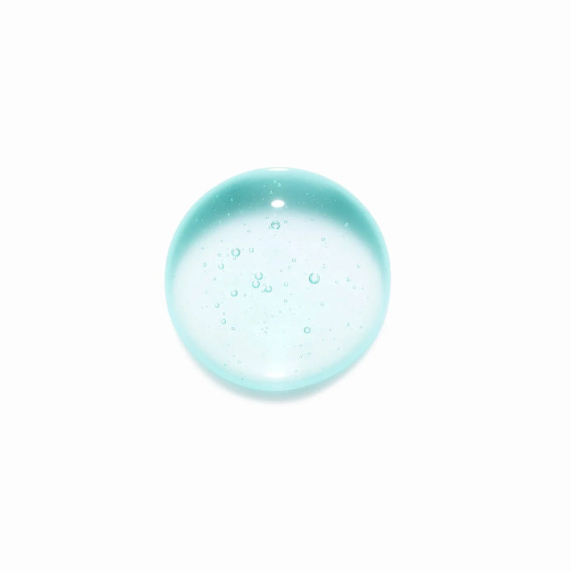 Clear blue glass gemstone with air bubbles on a white background