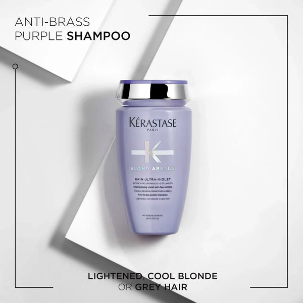Kérastase anti-brass purple shampoo bottle on a white background