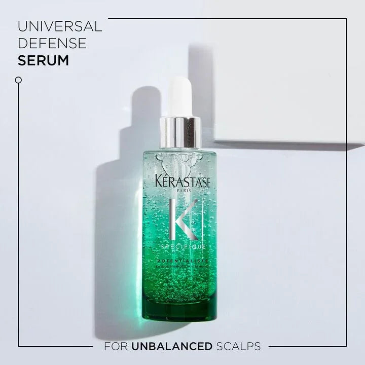 Kérastase serum bottle on a light gray background