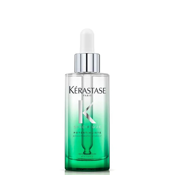Kérastase serum bottle with dropper on a white background