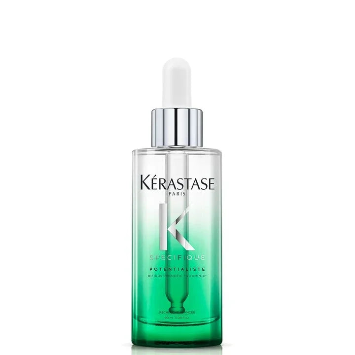 Kérastase serum bottle with dropper on a white background