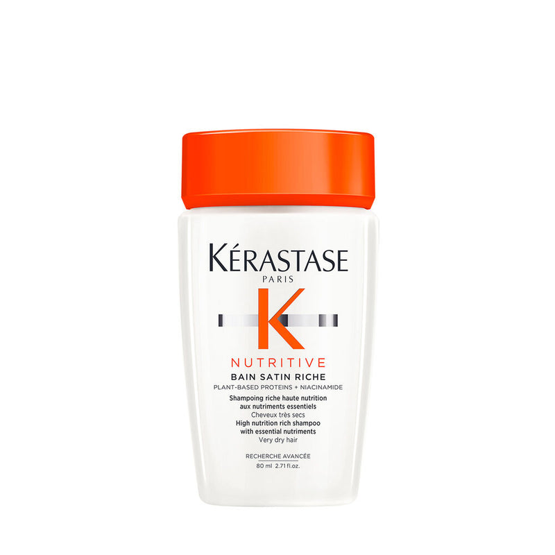 Kérastase Nutritive Bain Satin Riche shampoo bottle with orange cap on a white background