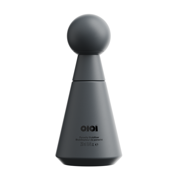 Dark gray bottle with spherical top on a white background