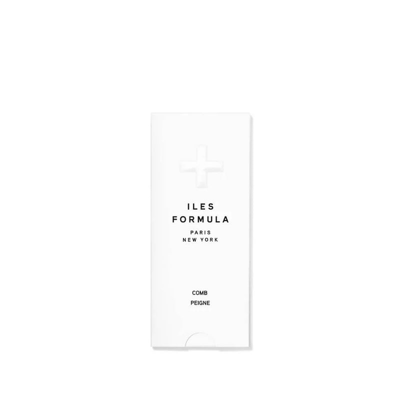 White comb and peigne packaging with 'ILES FORMULA PARIS NEW YORK' text on a white background