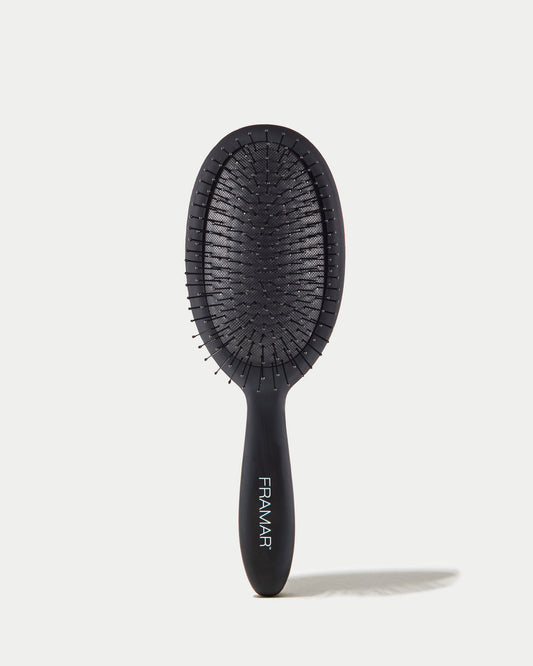 Black hairbrush with 'Framar' branding on a white background