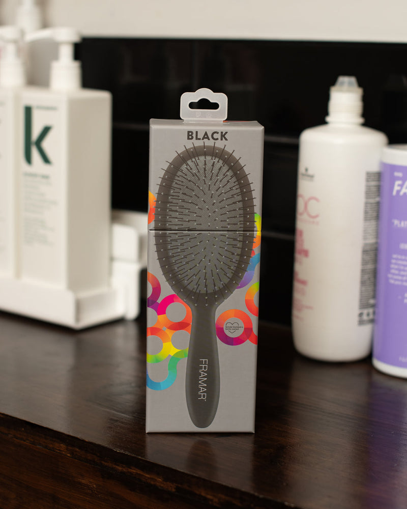Framar hairbrush packaging on a shelf with other products