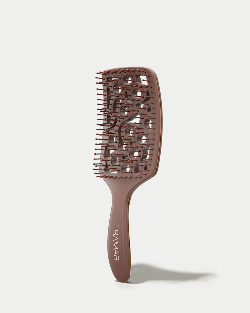 Brown hairbrush with 'Framar' branding on a white background