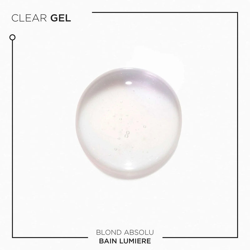 Texture of Bain Lumiere Shampoo on white background and text