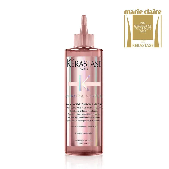 Kerastase bottle with a Marie Claire award on a white background