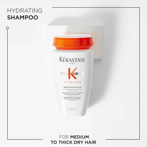 Kérastase Nutritive shampoo bottle with orange cap on a white background