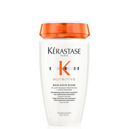 Kérastase Nutritive shampoo bottle with orange cap on a white background