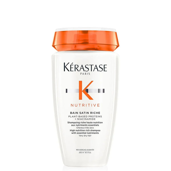 Kérastase Nutritive shampoo bottle with orange cap on a white background
