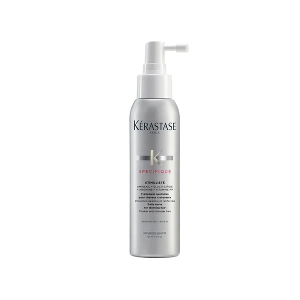 Kérastase hair care product bottle on a white background