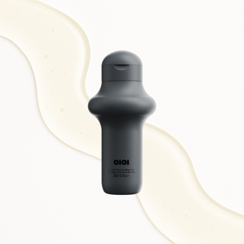 Dark gray water bottle with 'OIOI' branding on a light background