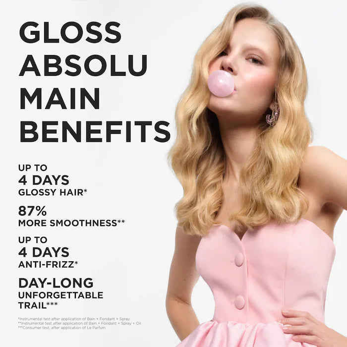 Woman blowing a bubble with gum, wearing a pink dress, against a white background with text about Gloss Absolu hair product benefits.