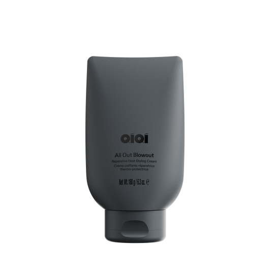Black hair product bottle with 'OIOI' branding on a white background