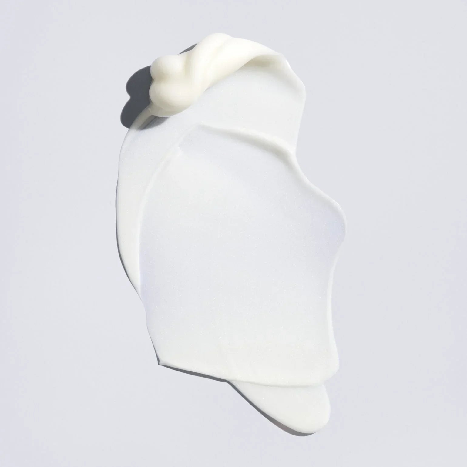 White silicone mold on a light gray background