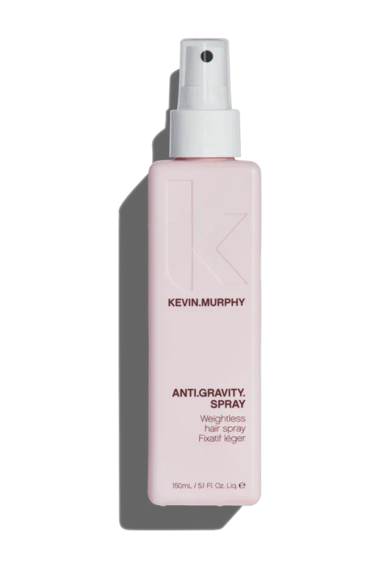 A pink spray bottle of Kevin Murphy Anti Gravity Spray for hair styling.
