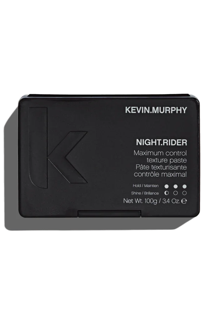 A black container of Kevin Murphy Night Rider hair styling paste with product information and branding visible.