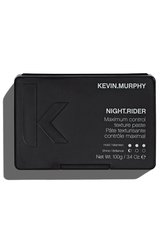 A black container of Kevin Murphy Night Rider hair styling paste with product information and branding visible.