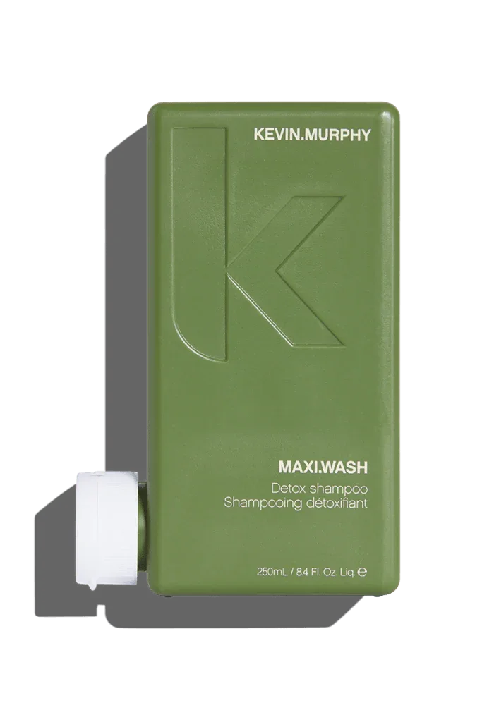 A 250 ml bottle of Kevin Murphy Maxi.Wash Shampoo with a green label and cap.