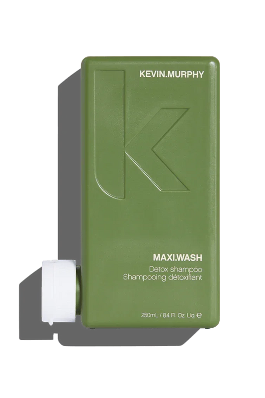 A 250 ml bottle of Kevin Murphy Maxi.Wash Shampoo with a green label and cap.