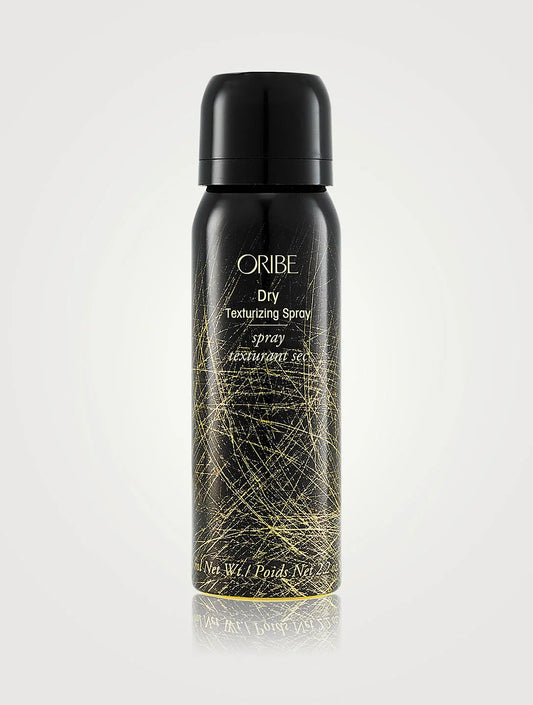 Bottle of ORIBE Dry Texturizing Spray Travel Size on white background