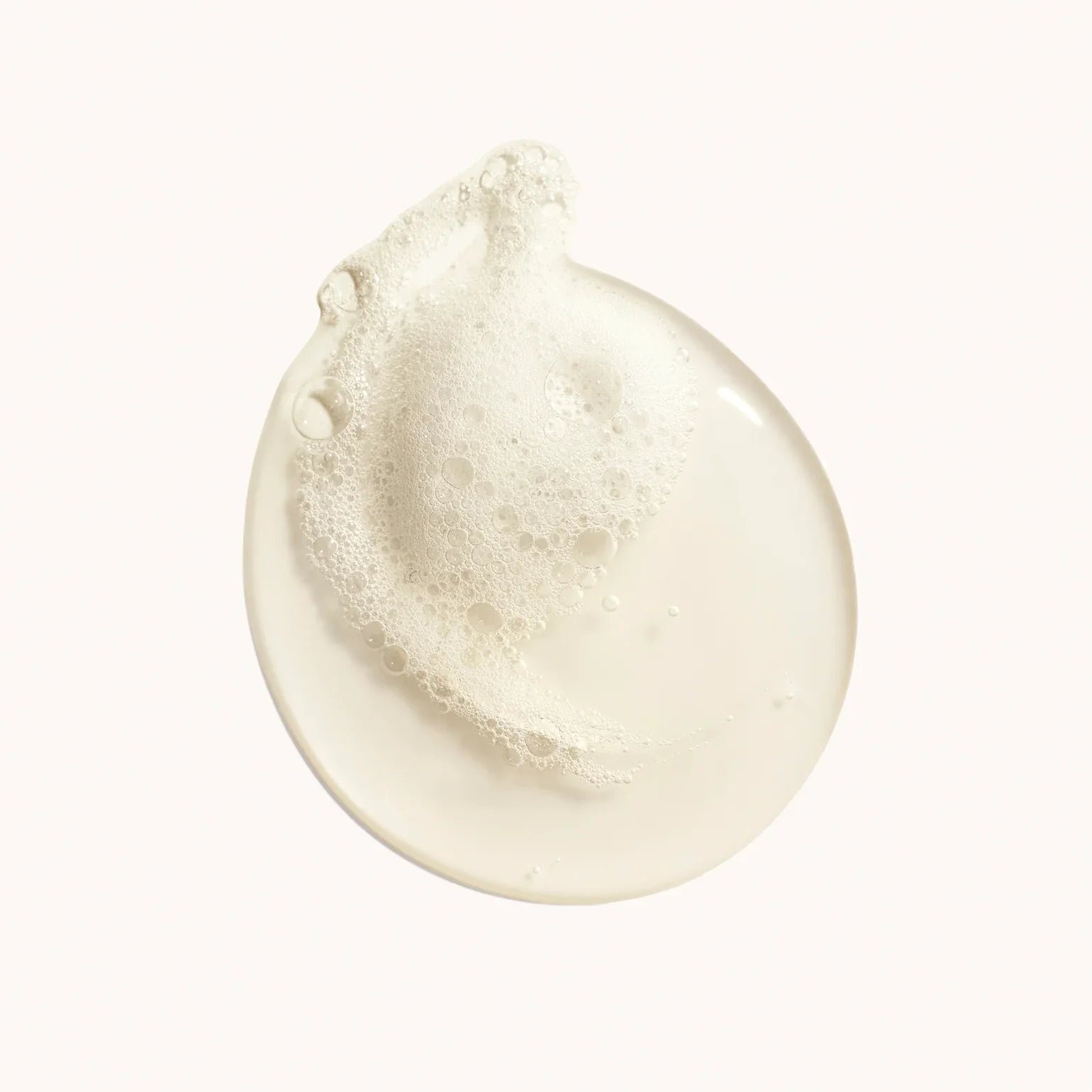 Close-up of a beige cream or soap bar on a white background