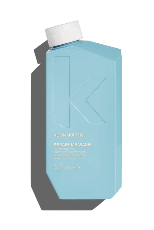 A blue bottle of Kevin Murphy Repair-Me.Wash Shampoo.