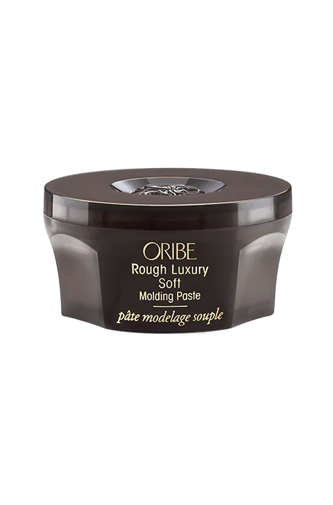 A container of ORIBE Rough Luxury Soft Molding Paste for hair styling.