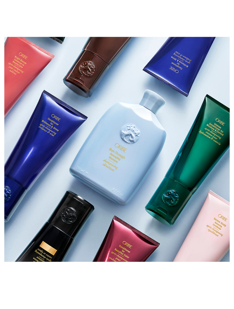 ORIBE Run-Through Detangling Shampoo bottle and conditioners