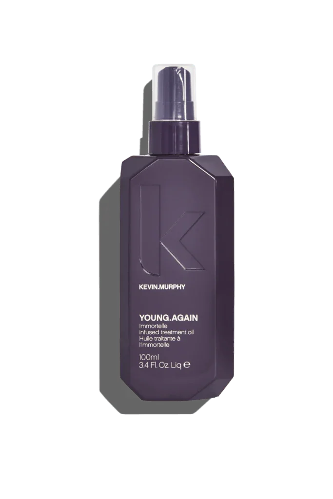 A spray bottle of Kevin Murphy Young.Again Oil, designed for damaged and ageing hair.